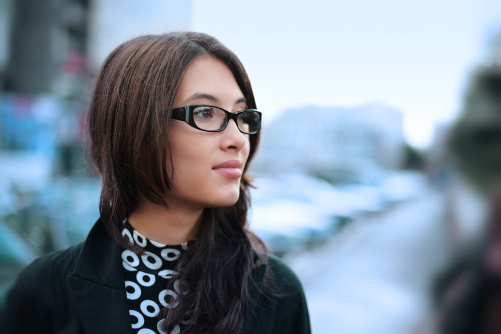 Stylish woman outside on city street