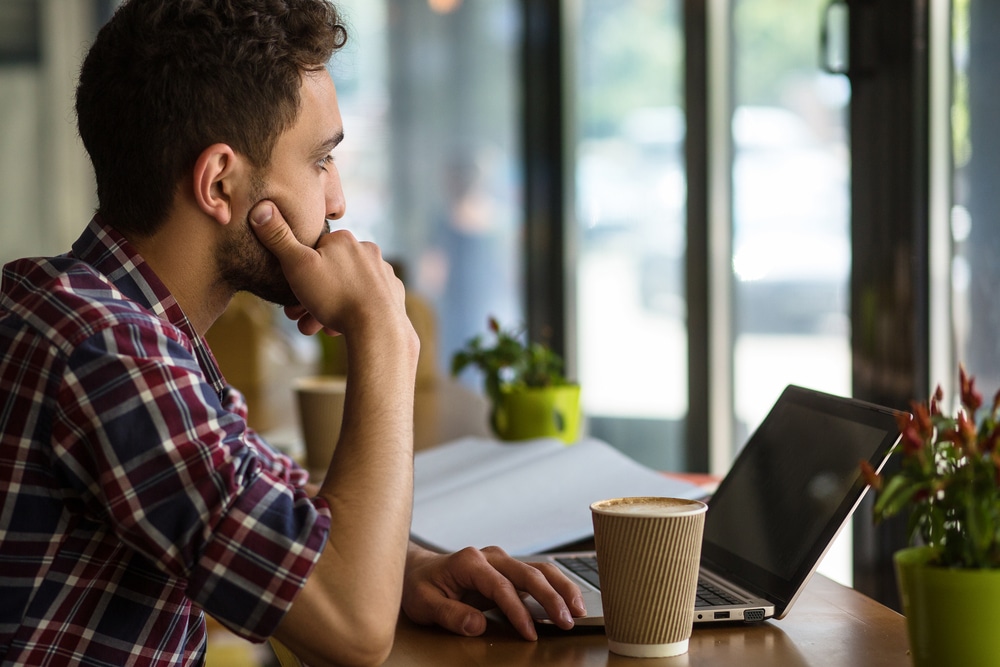 Man looking at a laptop