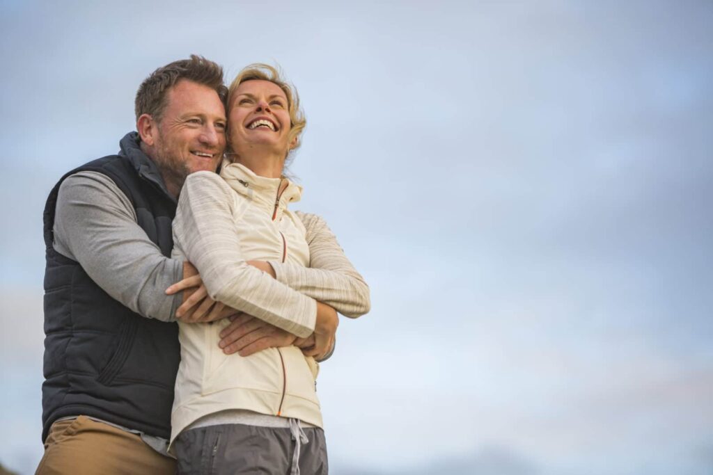 Happy older couple outside