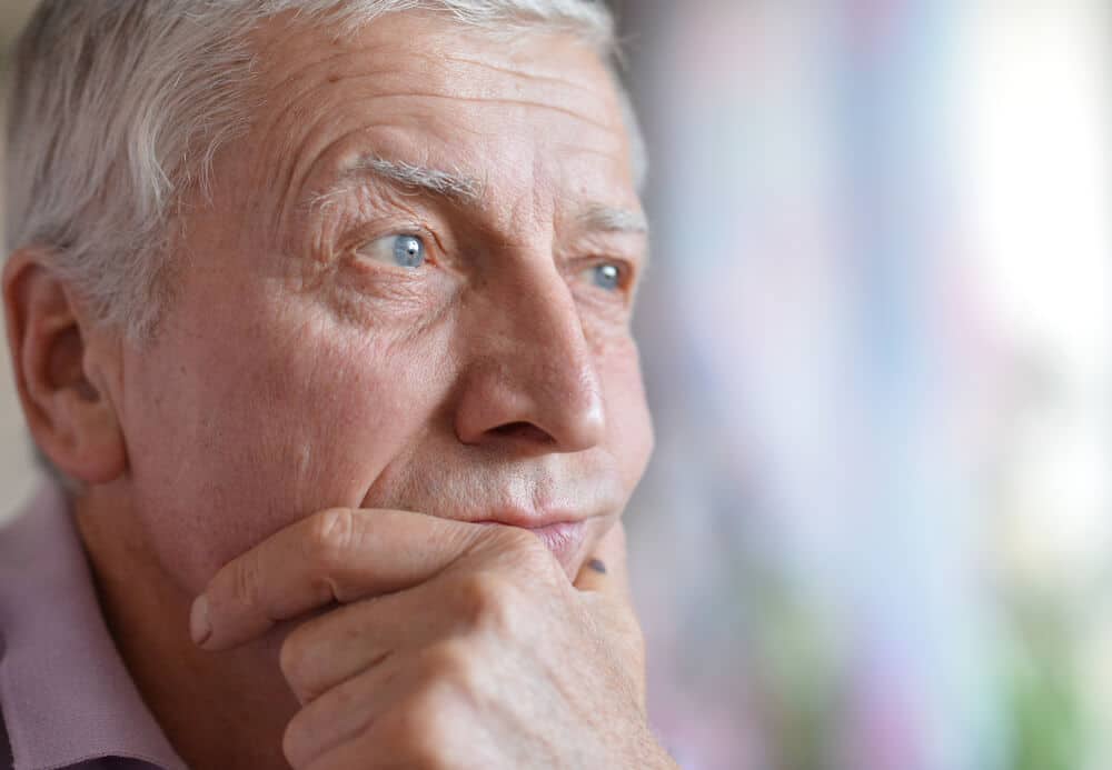 Close up of an older man thinking