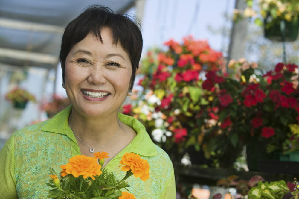 Smiling woman at a flower shop