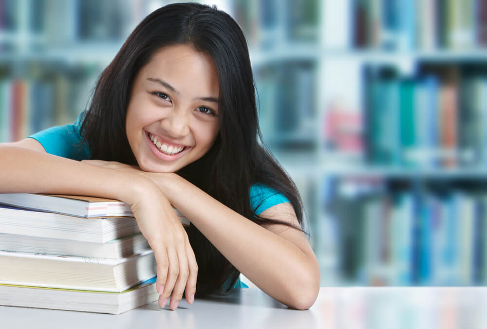 Smiling young woman at a library